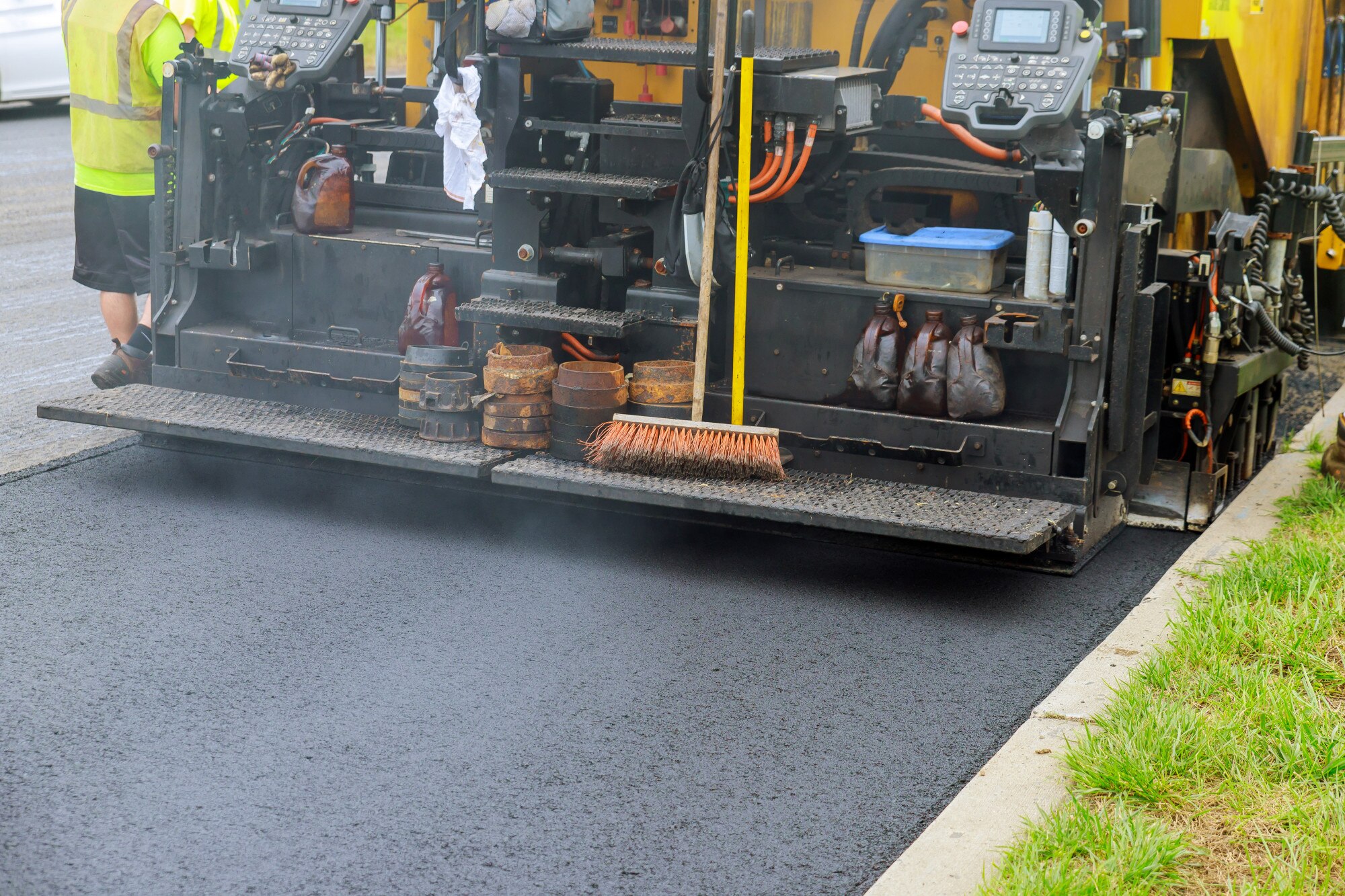 Representative asphalt paving equipment placing a smooth blacktop surface
